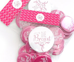 Button badges in poly bag with header card, Luminari Shop