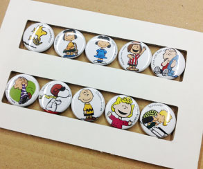 25mm button badges as a set of 10, cardboard packaging